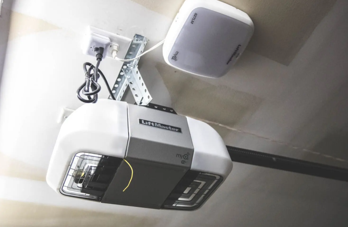 A Garage Door Repair Sarasota FL technician inspecting and repairing a garage door opener to ensure safe and reliable performance