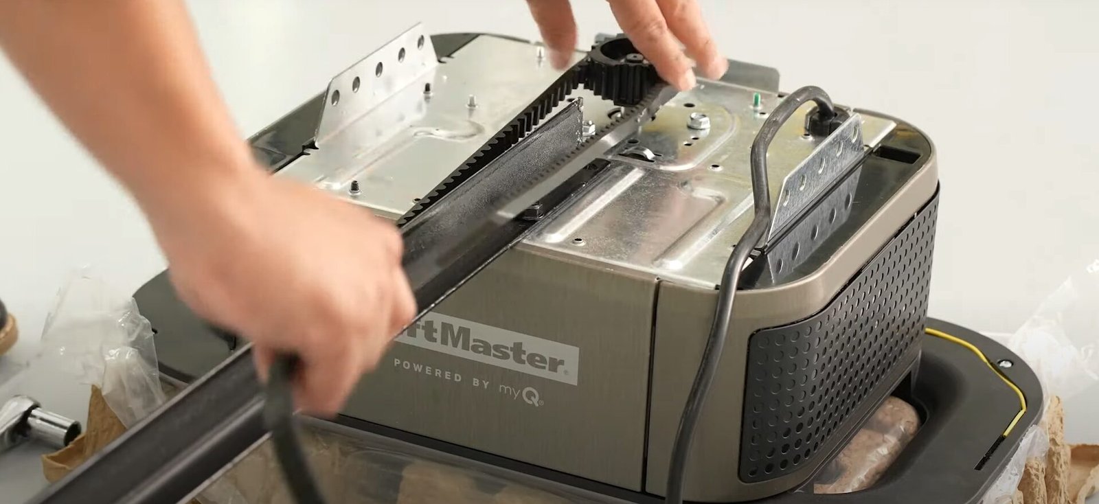 A Garage Door Repair Sarasota FL technician inspecting and repairing a garage door opener to ensure safe and reliable performance