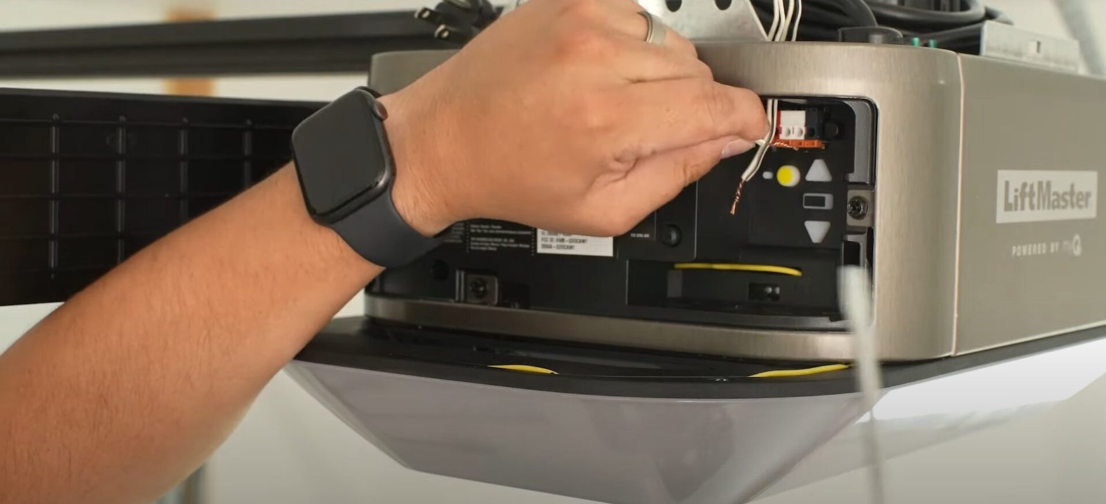 A Garage Door Repair Sarasota FL technician inspecting and repairing a garage door opener to ensure safe and reliable performance