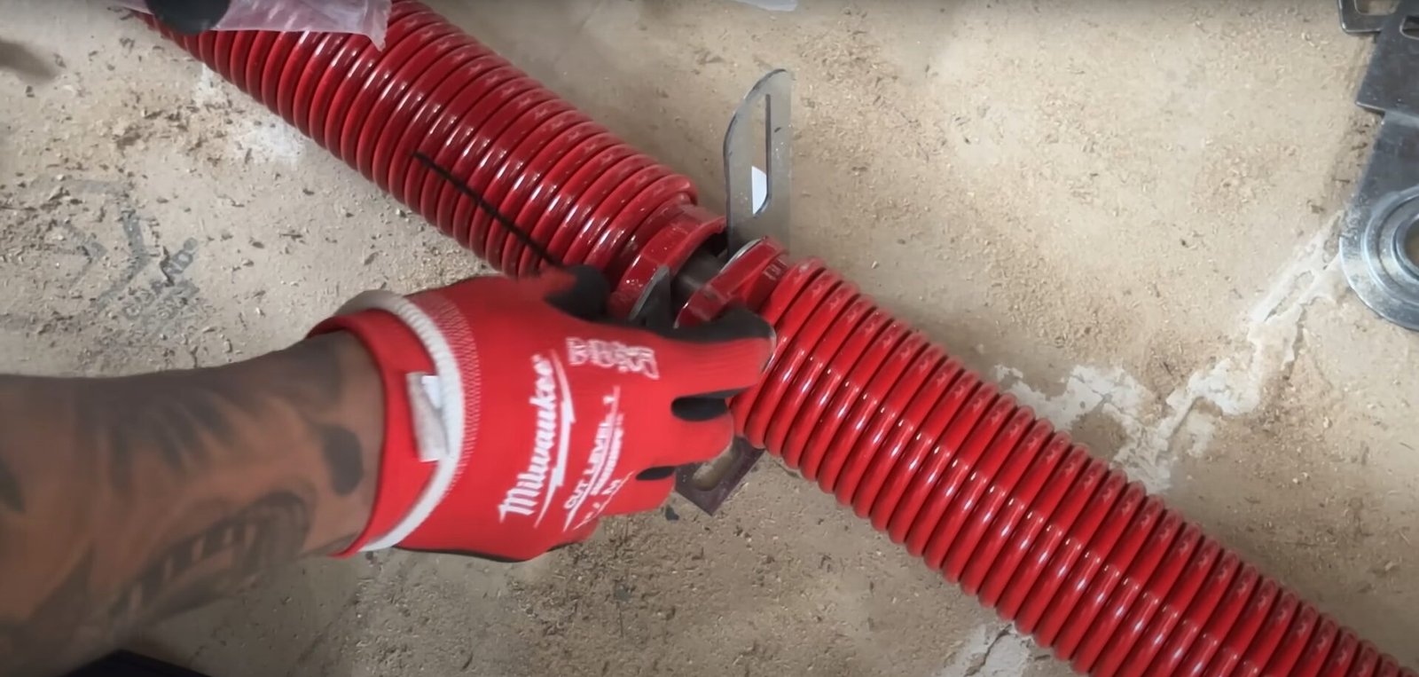 Professional technician repairing a garage door spring at Garage Door Repair Sarasota FL